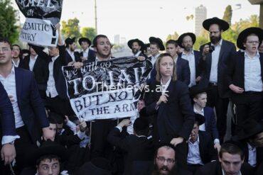 watch:-ultra-orthodox-jewish-men-block-highway-in-israel-in-protest-against-draft
